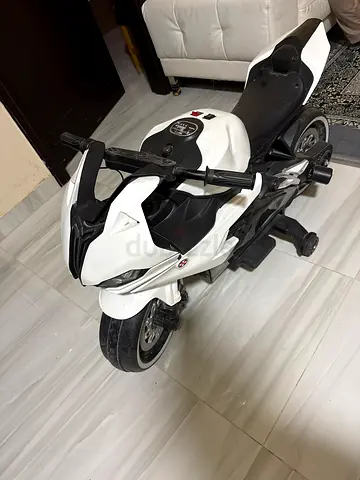 Kids electric ride-on sports motorcycle - white, good condition