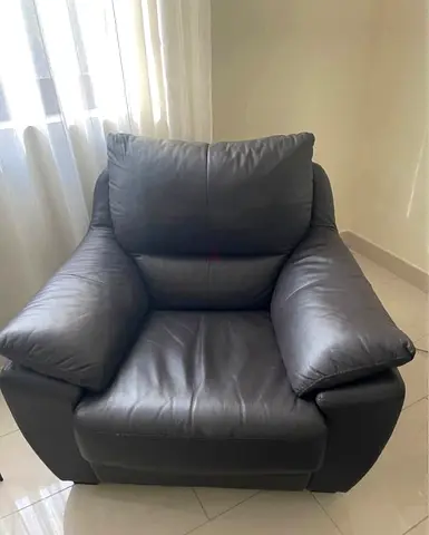 Large dark grey leather armchair — comfortable single seater