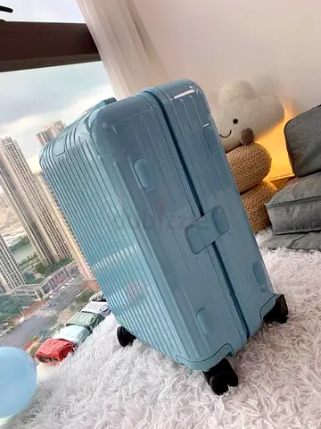 LIGHT BLUE RIMOWA ESSENTIAL SUITCASE