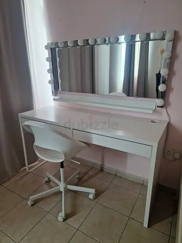 White vanity table with Hollywood mirror and swivel chair