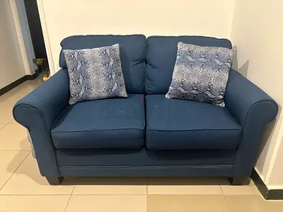 Blue 2-Seater Sofa in Good Condition with 2 Cushions - Negotiable Price