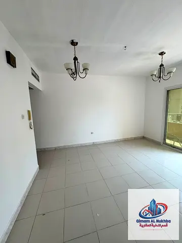 1BR behind ADNOC in Al Qulaya, with balcony, central AC and gas, close to services. AED 30K yearly, 4 or 6 payments, deposit by cheque.