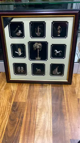 Framed Collection of 9 Silver Miniature -38cm height,38cm length