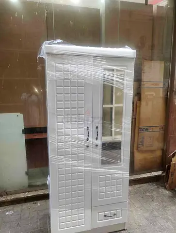 White freestanding wardrobe cabinet with glass panel and drawer - good condition