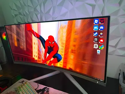 Philips Evnia 34M2C8600 is a 34-inch curved gaming monitor featuring a vibrant QD-OLED panel. It del