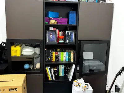 IKEA dark brown modular wall cabinet with shelves and glass doors and tv cupboard