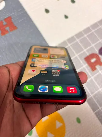 Red iPhone in good working condition, with charger (read description)