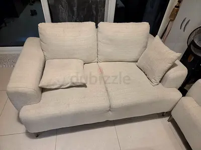 Two-seater and three seater beige fabric sofa in good condition