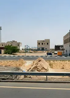 For sale: a residential and commercial plot in Al Malhah, directly on Al Dhaid Road