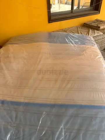 King size spring mattress - clean, unused (plastic covered)