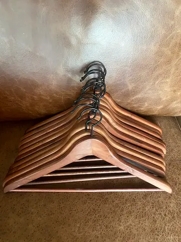 Set of 10 wooden hangers with trouser bar - good condition