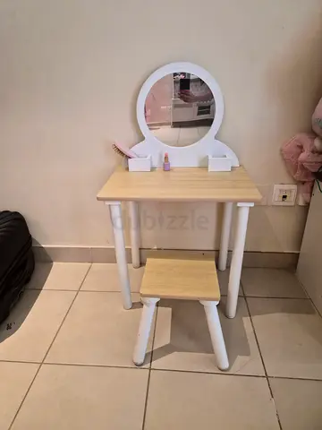 Small wooden vanity table with round mirror and matching stool