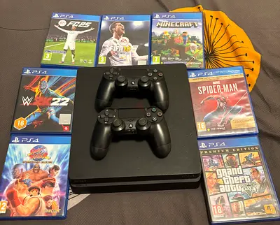 PS4 SLIM (with 7 popular games and 2 controller perfect condtion)