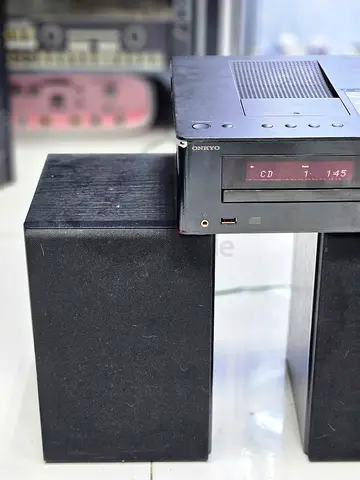 Onkyo CR-245 black CD receiver unit with a top-loading or integrated dock cover style