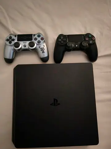 Sony PlayStation 4 Slim with 2 DualShock Controllers - Good Condition