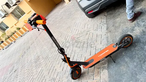 Used orange electric scooter in good condition