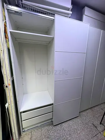 White sliding door wardrobe / armoire in good condition