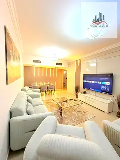 Sharjah, Al Taawun area: For sale, two bedrooms, living room, kitchen, three bathrooms, and balcony.