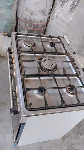 Used freestanding 4-burner gas stove with oven - stainless top