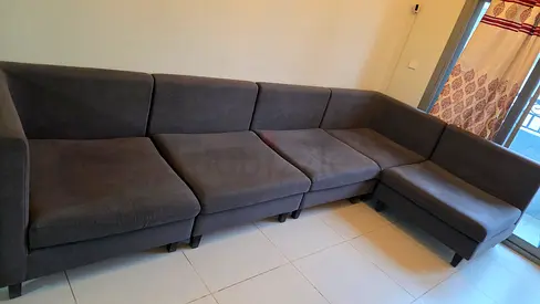 Dark grey L-shaped fabric sofa - 5-seater, good condition