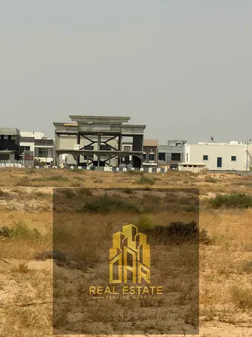 Corner Commercial Plot for Sale in Al Ruwaydhat – Freehold Ownership