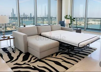 Beige L-shaped sofa bed with chaise and mattress - excellent condition