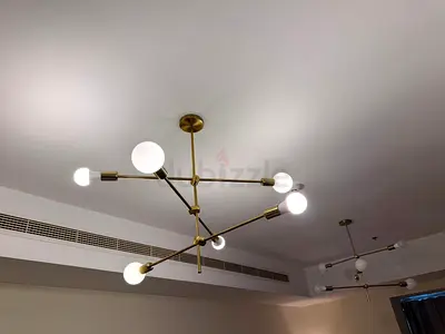 Modern brass multi-arm chandelier with globe bulbs (one light )