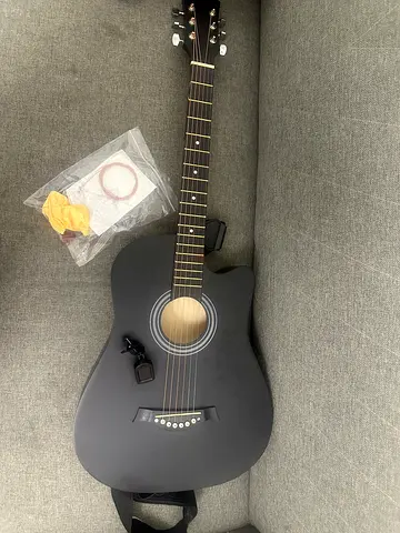 Matte Black Acoustic Guitar with Strap and Accessories - New, 1/2 time used.