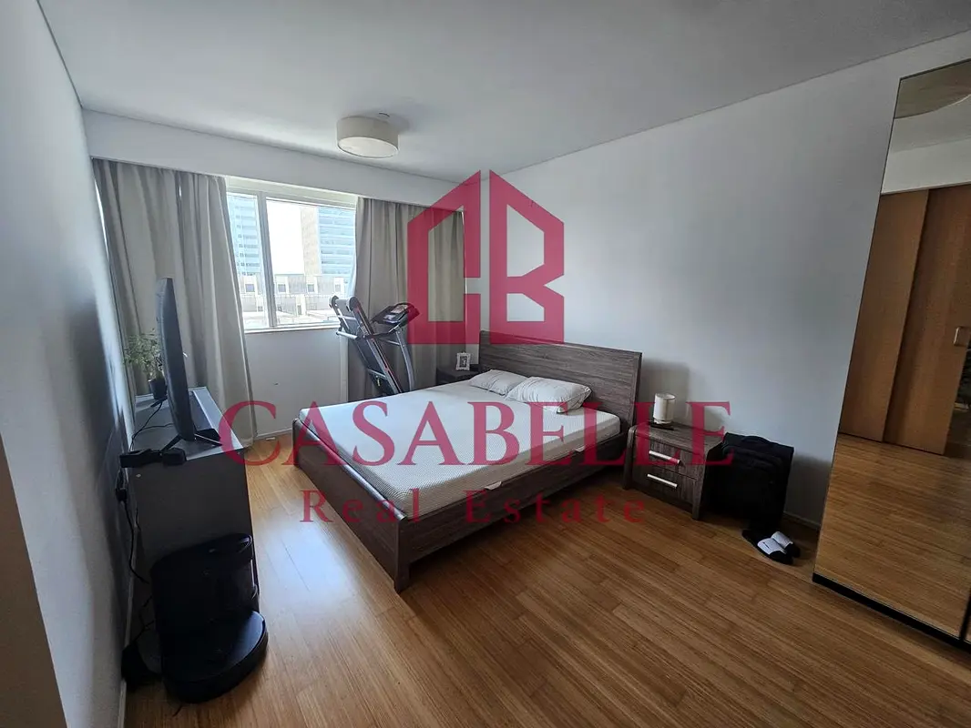 Elegant 1BR apartment with spacious balcony & city view.