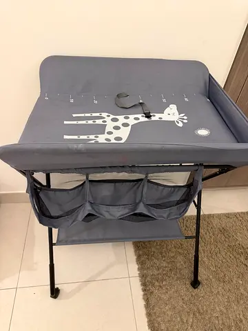 Giraffe print baby changing table with storage - good condition