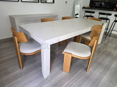 Modern white wooden dining table with 6 mid-century chairs