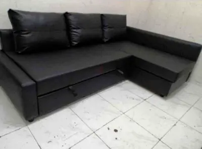 Black L-shaped Faux Leather Sofa with Storage — Good Condition