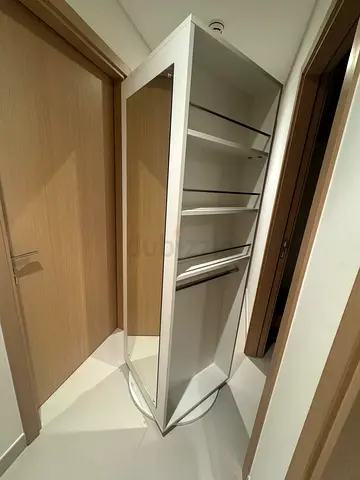 White wardrobe with mirrored door and shelves