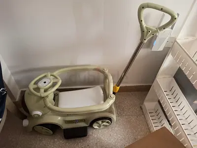 Child ride-on push car with parent handle — good condition