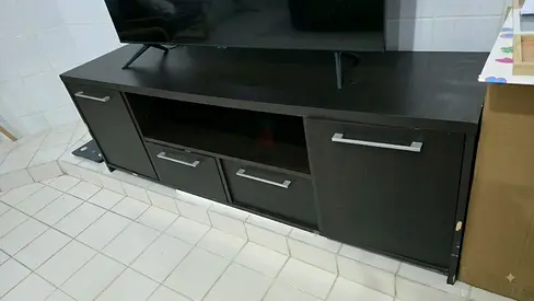 Dark wood TV cabinet with drawers and storage, average condition,  have some scratches.