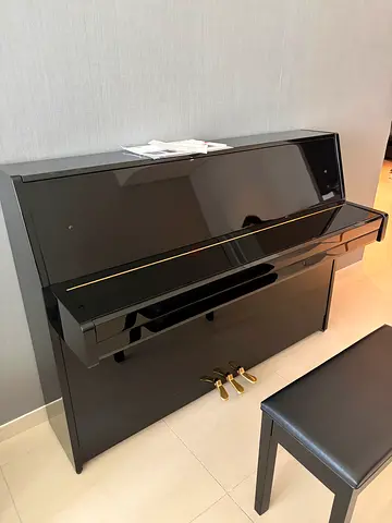 Black upright yamaha piano. Bought one year ago, very good condition barely used