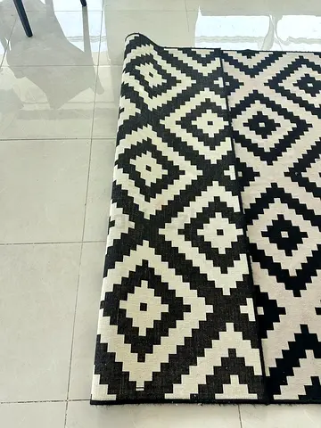 Black and white geometric area rug - good condition