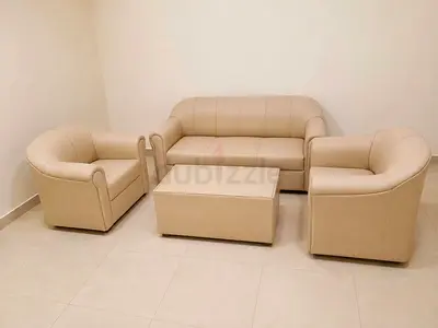 Beige 3-piece leather sofa set with coffee table