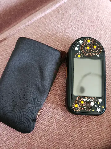 Nokia flip phone with decorative gems - good working condition