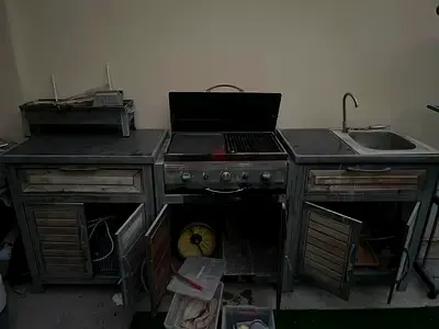 Fully functional outdoor grill in need of cleaning and renovation