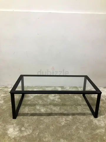 Black coffee table with glass top