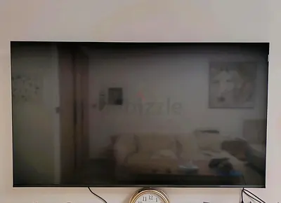 55-65 inch wall-mounted flat screen TV - good condition