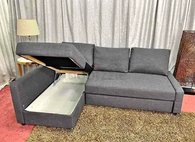 Grey L-shaped Sofa with Storage and Pull-Out Bed — Good Condition