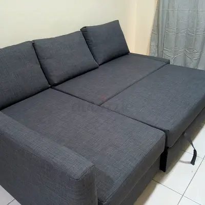Grey fabric sofa bed with pull out section