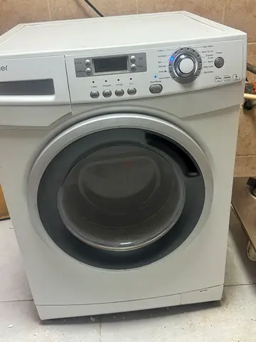 Front-load washing machine with 100% dryer good working condition