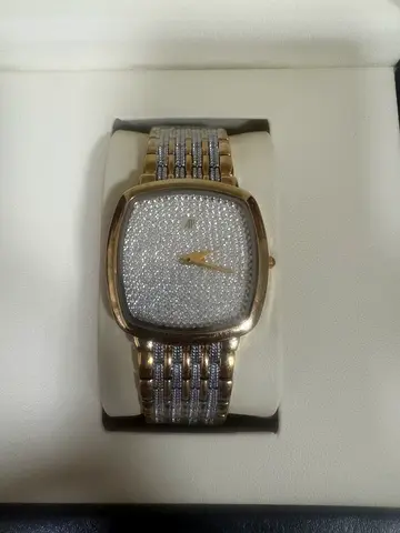 Gold-tone women's wristwatch with crystal-studded dial