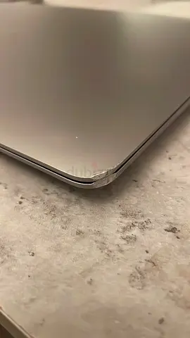 Used laptop with dented corner — selling as-is