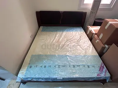 King size wooden bed frame with new mattress included