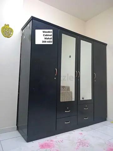 4-door dark wood wardrobe with mirrors — good condition, 300 AED