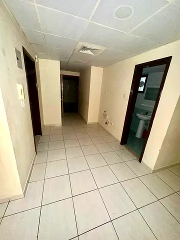 2-bedroom apartment with a living room in Al Qasba; direct listing. Payment via 4 or 6 cheques. Prime location with full amenities.